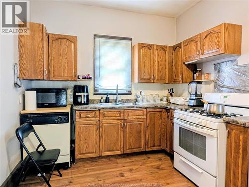 77 Askew, Leamington, ON - Indoor Photo Showing Kitchen With Double Sink