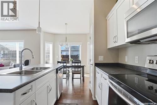 983 Pringle Cove, Saskatoon, SK - Indoor Photo Showing Kitchen With Double Sink