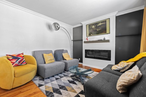 Salon - 6705 Rue Rivière, Laval (Auteuil), QC - Indoor Photo Showing Living Room With Fireplace