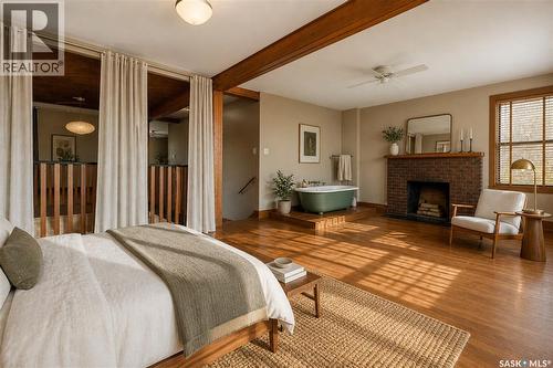1002 9Th Street, Perdue, SK - Indoor Photo Showing Bedroom With Fireplace
