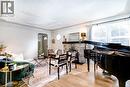 Spacious living room with a cozy wood fireplace - 3 Fallsview Road, Hamilton, ON  - Indoor 