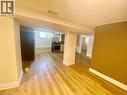 Open-concept living area with wood-finish flooring, white baseboards, and neutral wall tones - 63 Audrey Street, Hamilton, ON  - Indoor Photo Showing Other Room 