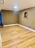 Light wood-finish flooring with crisp white baseboards - 63 Audrey Street, Hamilton, ON  - Indoor Photo Showing Other Room 