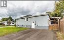 Light blue horizontal siding exterior with a white entry door - 63 Audrey Street, Hamilton, ON  - Outdoor 