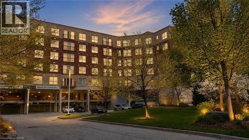 Multi-story residential building featuring a brick and stone facade - 20 St. George Street Unit# 404, Kitchener, ON - Outdoor