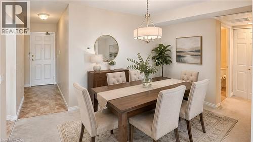 Virtually Staged - 20 St. George Street Unit# 404, Kitchener, ON - Indoor Photo Showing Dining Room