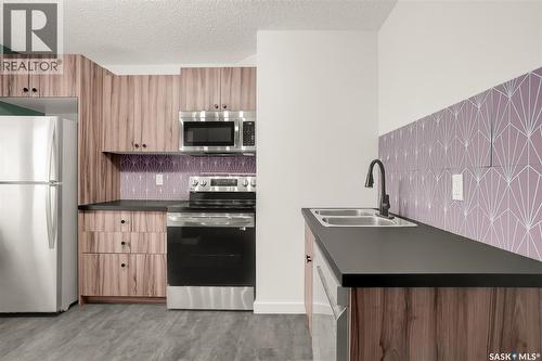 1917 Cairns Avenue, Saskatoon, SK - Indoor Photo Showing Kitchen With Double Sink