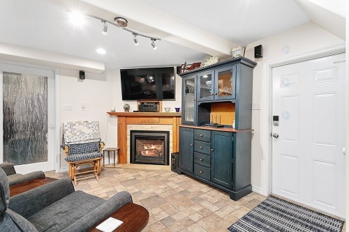 Living Room - 16 Rue Mill, Portage-Du-Fort, QC - Indoor With Fireplace