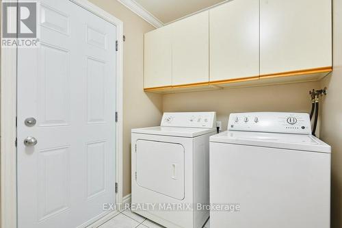 Convenient door to deck. Perfect for future pool! - 1340 Cuthbert Way, Ottawa, ON - Indoor Photo Showing Laundry Room