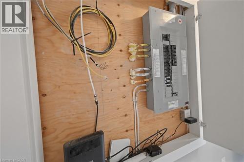 Electrical panel with multiple circuits mounted on a plywood backer board - 3 Hagar Street, Thorold, ON - Indoor
