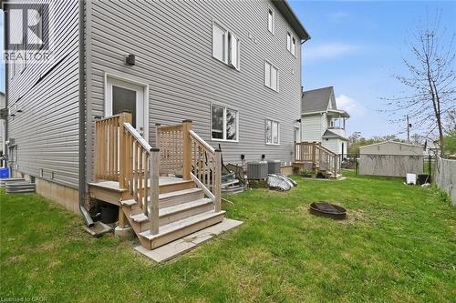 Rear exterior with horizontal vinyl siding and a wood deck - 3 Hagar Street, Thorold, ON - Outdoor