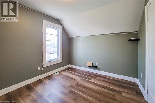 Attic room featuring wood-finish flooring and a multi-pane window - 334 Gage Avenue N, Hamilton, ON - Indoor Photo Showing Other Room