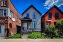 Light blue siding exterior with a dark gray porch and gabled roof - 334 Gage Avenue N, Hamilton, ON  - Outdoor With Facade 