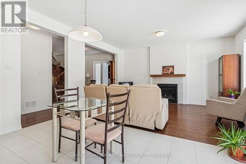 845 Snap Hook Crescent, Ottawa, ON - Indoor Photo Showing Dining Room With Fireplace