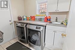 Main Floor Laundry with Garage Access - 