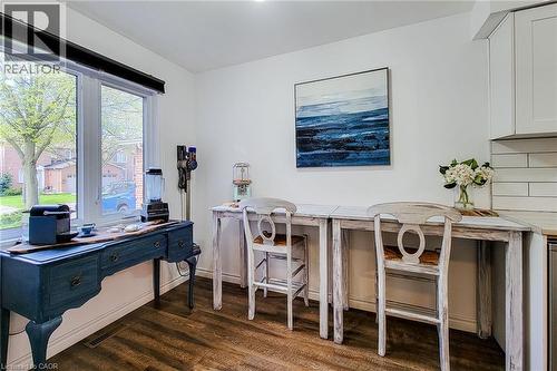 Bright interior space featuring wood-finish flooring and white painted walls - 7 Davidson Boulevard Unit# 14, Dundas, ON - Indoor Photo Showing Office