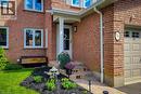 Brick exterior with white window frames and a covered front entry - 7 Davidson Boulevard Unit# 14, Dundas, ON  - Outdoor With Exterior 