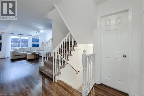 Carpeted staircase with white balusters leading to upper level - 7 Davidson Boulevard Unit# 14, Dundas, ON - Indoor Photo Showing Other Room