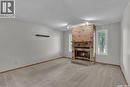 1409 Rothwell Street, Regina, SK  - Indoor Photo Showing Living Room With Fireplace 