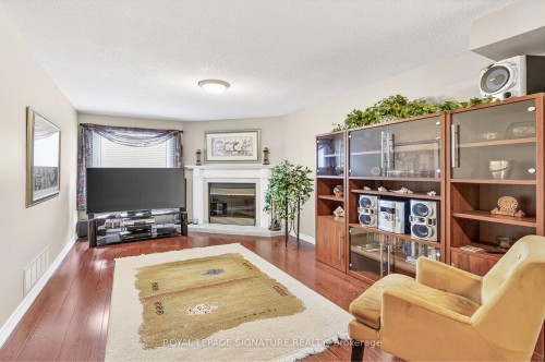 566 Huntington Ridge Drive, Mississauga, ON - Indoor Photo Showing Living Room With Fireplace