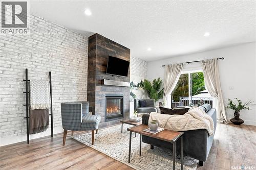 158 3220 11Th Street W, Saskatoon, SK - Indoor Photo Showing Living Room With Fireplace