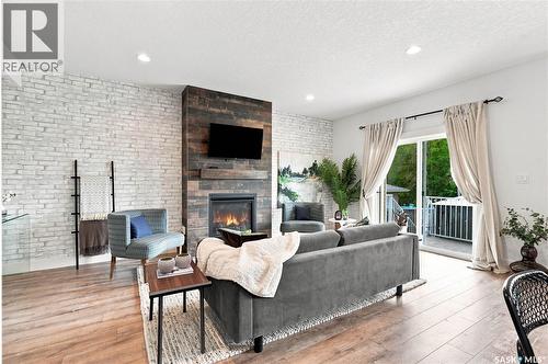 158 3220 11Th Street W, Saskatoon, SK - Indoor Photo Showing Living Room With Fireplace