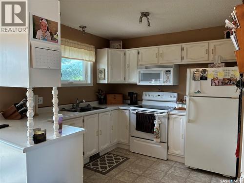 8 Hahn Crescent, Kindersley, SK - Indoor Photo Showing Kitchen With Double Sink