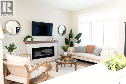 442 Fortosky Manor, Saskatoon, SK - Indoor Photo Showing Living Room With Fireplace