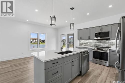 801 Kerr Cove, Prince Albert, SK - Indoor Photo Showing Kitchen With Stainless Steel Kitchen With Double Sink With Upgraded Kitchen