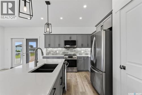 801 Kerr Cove, Prince Albert, SK - Indoor Photo Showing Kitchen With Stainless Steel Kitchen With Double Sink With Upgraded Kitchen