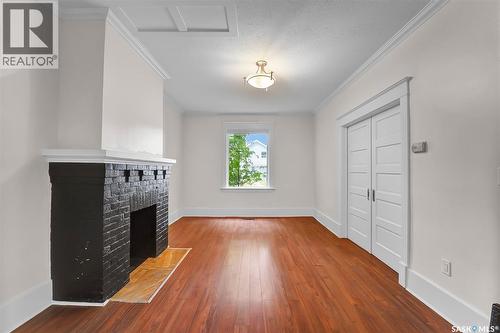 736 7Th Avenue N, Saskatoon, SK - Indoor Photo Showing Other Room With Fireplace