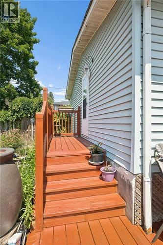 Wood-tone deck with stairs and railing, leading to an exterior door - 162 Tiffany Street, Cambridge, ON - Outdoor With Exterior