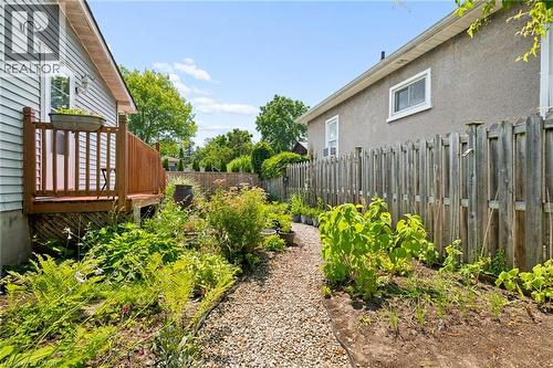 Backyard with a gravel path, established garden beds, and mature plantings - 162 Tiffany Street, Cambridge, ON - Outdoor