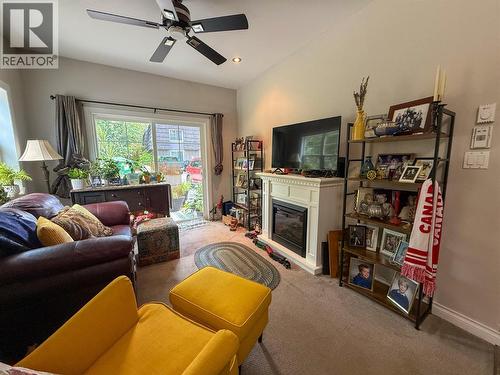 2011 Perrier Road Unit# 103, Nelson, BC - Indoor Photo Showing Living Room With Fireplace