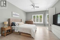 Light-toned wood-finish flooring complements the neutral wall color - 