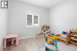 Neutral painted walls with light wood-finish flooring - 