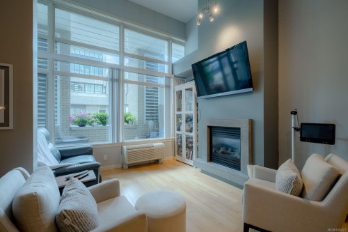 #103-38 Front St, Nanaimo, BC - Indoor Photo Showing Living Room With Fireplace
