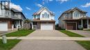Two-story residence featuring a white siding upper level and a brick lower level - 10 Doll Court, Kitchener, ON  - Outdoor With Facade 