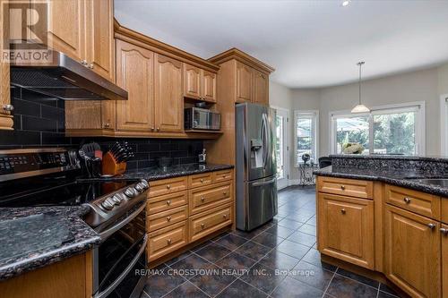 Kitchen with stainless appliances - 5 Pine Hill Drive, Springwater, ON - Indoor Photo Showing Kitchen