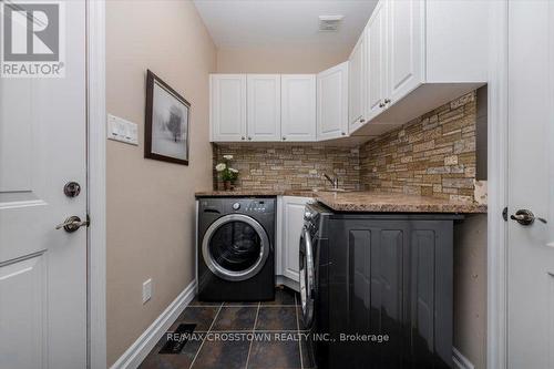 Main floor laundry / mudroom - 5 Pine Hill Drive, Springwater, ON - Indoor Photo Showing Laundry Room