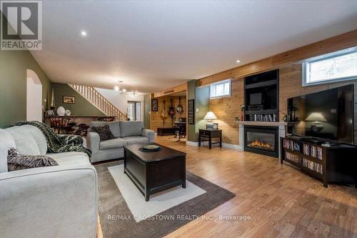 Lower level recreation room - 5 Pine Hill Drive, Springwater, ON - Indoor Photo Showing Living Room With Fireplace