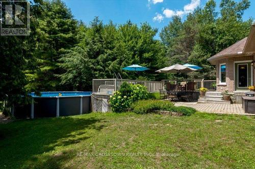 Rear yard - 5 Pine Hill Drive, Springwater, ON - Outdoor With Above Ground Pool