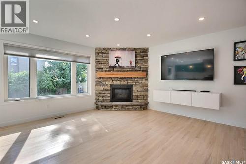 3544 Basswood Grove, Regina, SK - Indoor Photo Showing Living Room With Fireplace