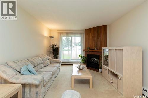 111 425 115Th Street E, Saskatoon, SK - Indoor Photo Showing Living Room With Fireplace