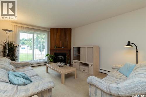 111 425 115Th Street E, Saskatoon, SK - Indoor Photo Showing Living Room With Fireplace