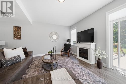 103 Stephenson Way, Minto, ON - Indoor Photo Showing Living Room With Fireplace