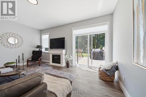 103 Stephenson Way, Minto, ON - Indoor Photo Showing Living Room With Fireplace