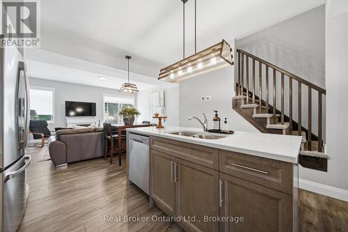 103 Stephenson Way, Minto, ON - Indoor Photo Showing Kitchen With Double Sink