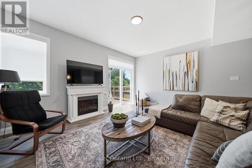 103 Stephenson Way, Minto, ON - Indoor Photo Showing Living Room With Fireplace