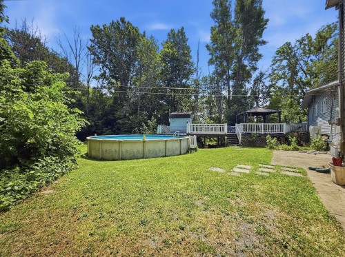 Cour - 192 12E Avenue O., Venise-En-Québec, QC - Outdoor With Above Ground Pool With Backyard